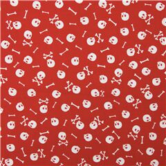 Tela roja con lluvia de calaveras y huesos cruzados Tela de Timeless Treasures