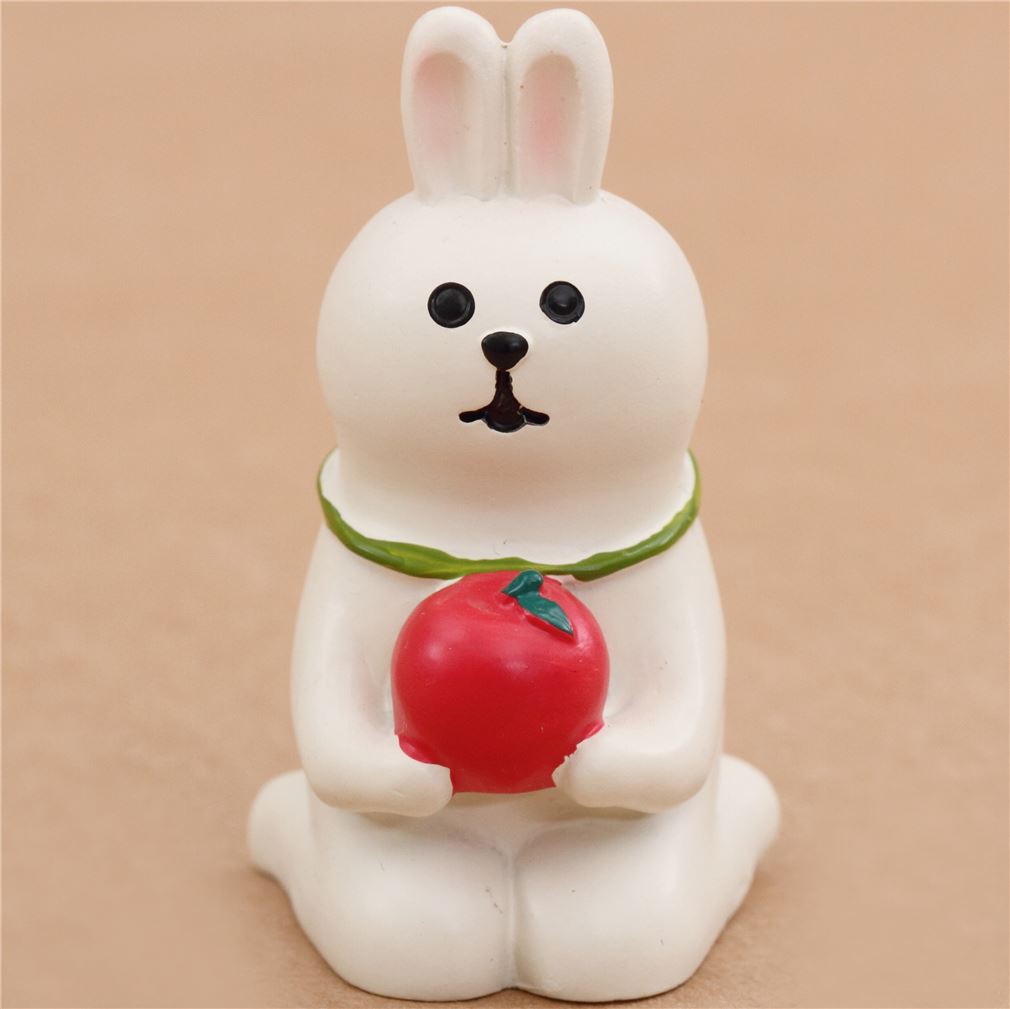 cute cream colored kneeling rabbit with apple figure picnic animals