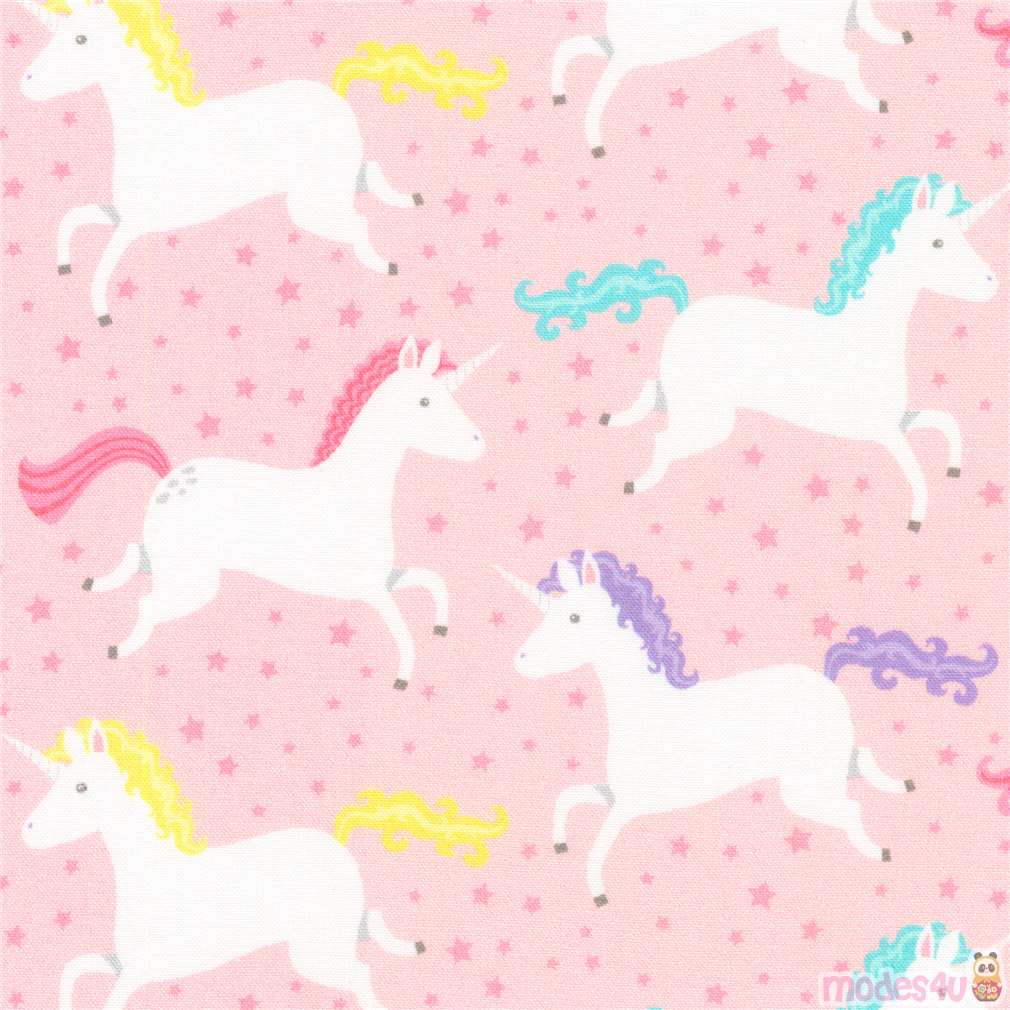 light pink Robert Kaufman fabric with white unicorns and mini stars