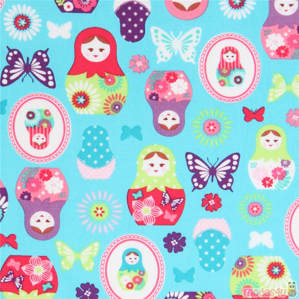 turquoise with Matryoshka butterfly oxford fabric by Kokka Fabric by