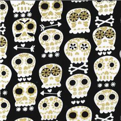 Tissu noir avec des ttes de mort, des dcos or mtallique Tissu