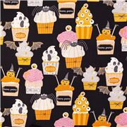 Tissu noir avec des citrouilles fantômes, des friandises d'Halloween