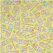 Tissu Kokka Oxford jaune avec des piles et rangées d'animaux Sumikkogurashi