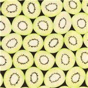 Tissu en coton noir avec des kiwis verts des fruits en tranches