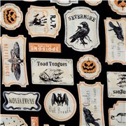 Tissu noir avec des plaques d'Halloween vintage