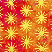 Tissu batik en coton orange rouge avec des étoiles vertes aspect teinté
