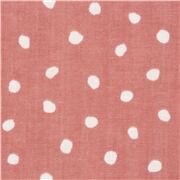 Tissu gaze en coton japonais rose avec des pois blancs rustiques irréguliers