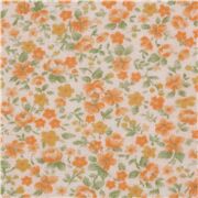 Tissu jersey lisse écru avec des petites fleurs orange importé du Japon