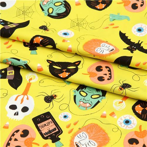 Halloween fabric with skulls and cats by Alexander Henry in chartreuse modeS4u