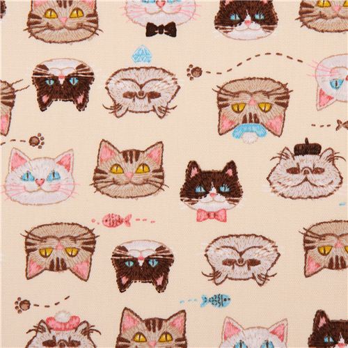 Tela oxford crema graciosa cara gato pez de Kokka Tela