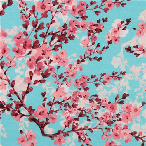 Tela de punto azul celeste con pequeñas flores rosas Tela