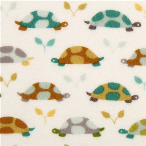 white Michael Miller animal flannel fabric with teal turtles 1