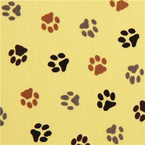yellow dog paw animal fabric by Robert Kaufman Fabric by Robert Kaufman