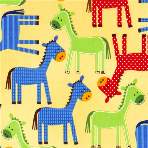 yellow fabric with dotted horses by Robert Kaufman USA 1