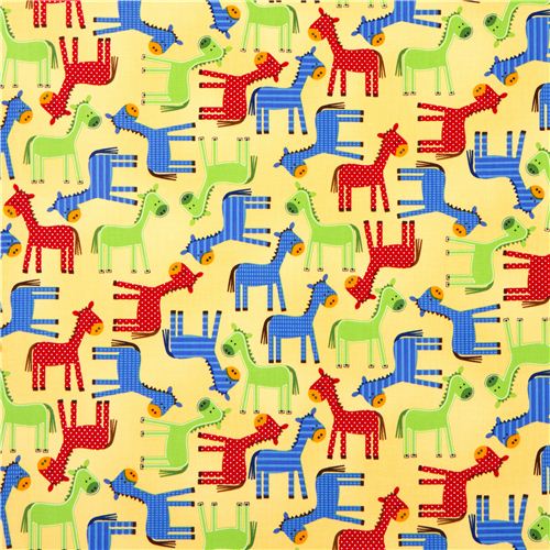 yellow fabric with dotted horses by Robert Kaufman USA 2